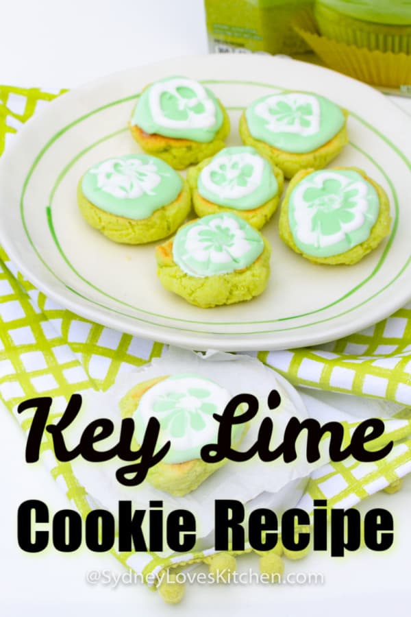 six key lime cookies on a plate and one key lime cookie on a smaller plate in front of larger plate of cookies