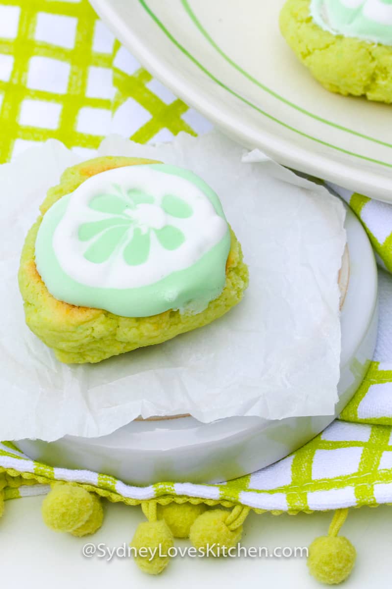 key lime cookie on a plate placed on a green checkered table cloth