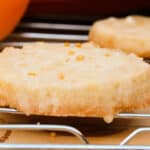 close up of orange cookie with glaze