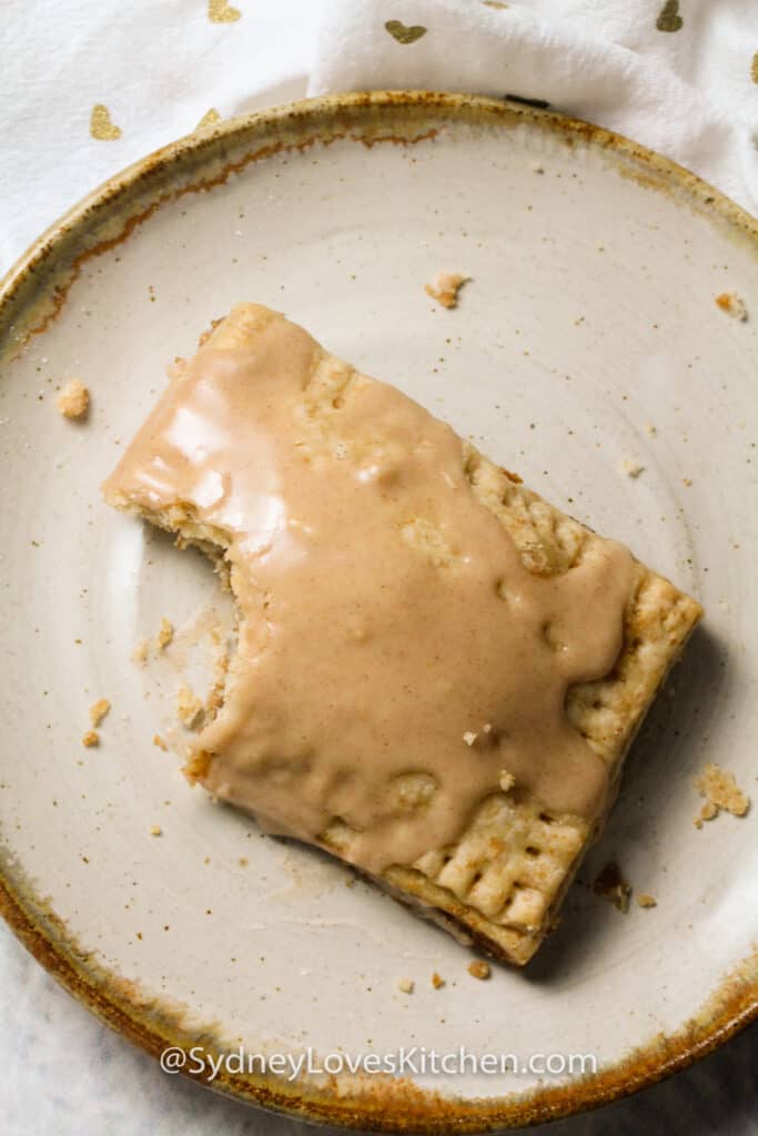 homemade pop tart with frosting and a bite out of it